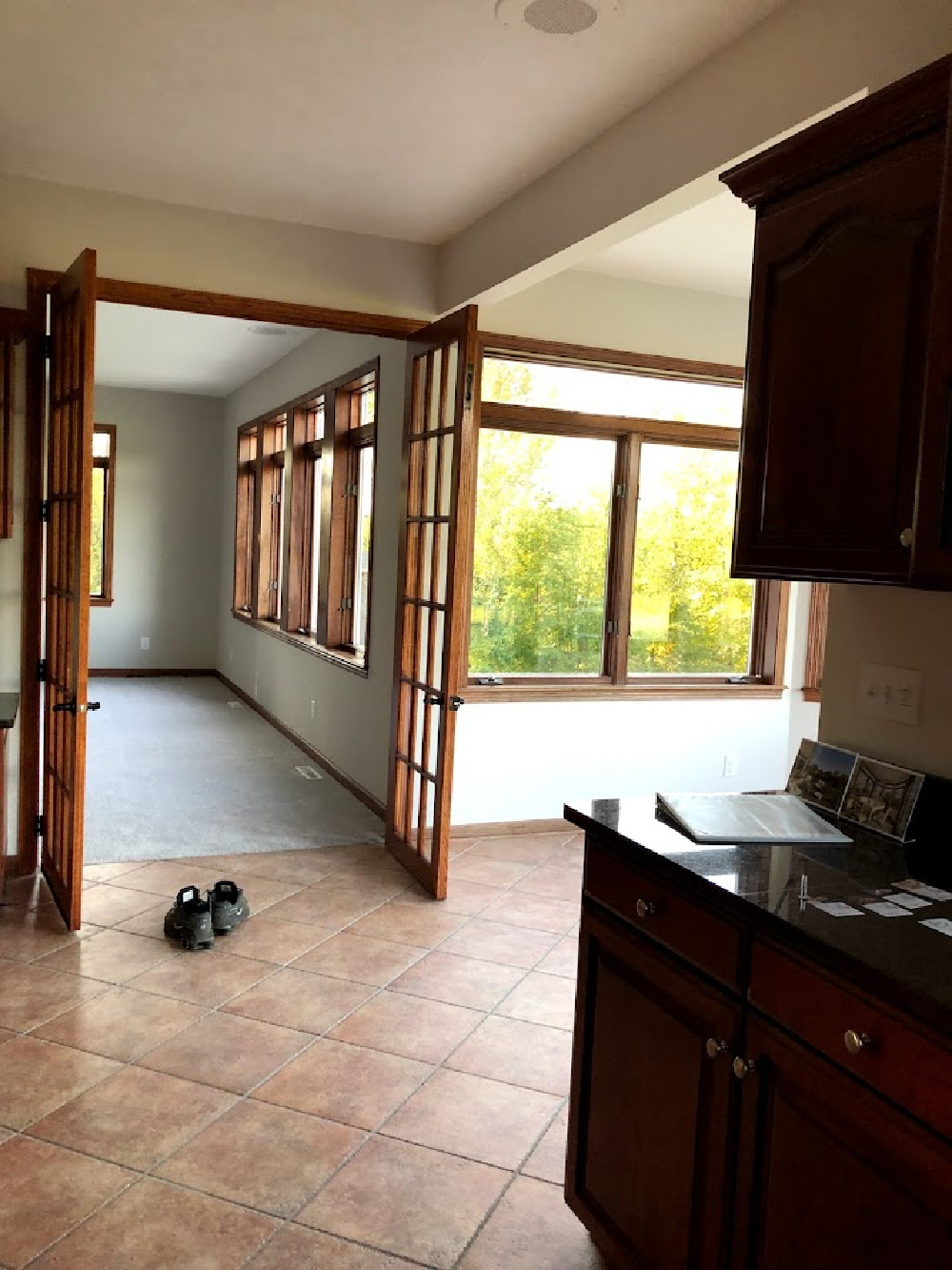 Oak trim French doors to family room from kitchen before we renovated - Hello Lovely Studio.