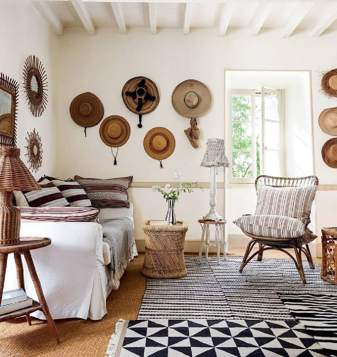 Rustic refined living room in France (Luncinda Chambers) with charming straw hats on wall - @houseandgardenuk. #frenchcountry #frenchrustic #rusticrefined #livingroom #interiordesign #livingrooms #rusticdecor