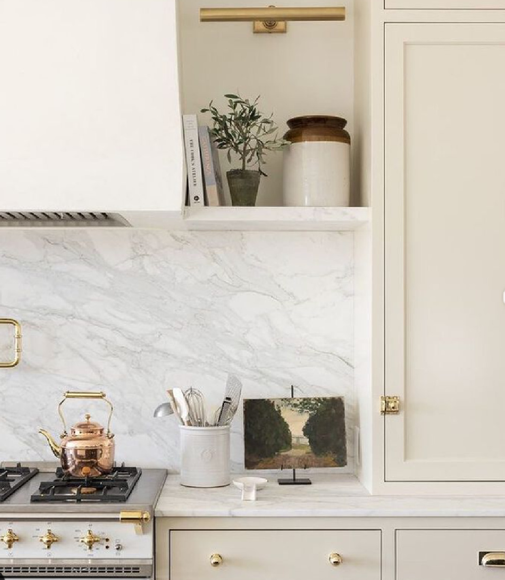 Warm white kitchen with putty cabinets and marble slab backsplash with French range - Studio McGee. #whitekitchens #warmwhitekitchen #puttycabinets