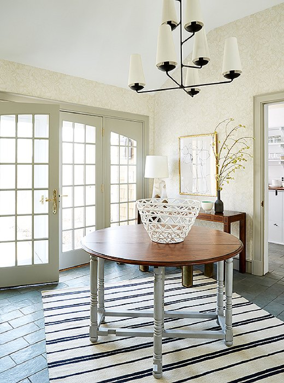 Beautiful French doors, stripe rug, and round table with modern chandelier - OKL.