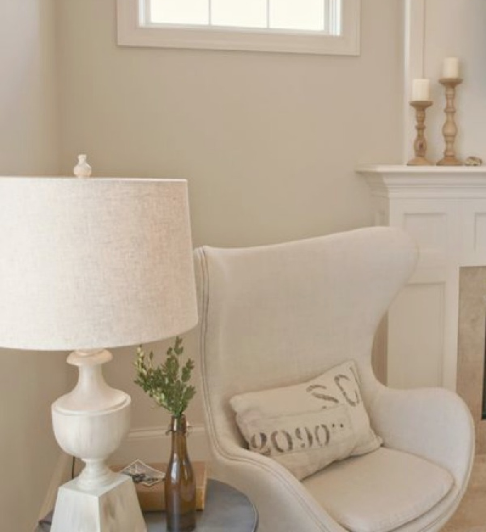 Hello Lovely Studio's living room with egg chair upholstered in Belgian linen and Benjamin Moore White Sand paint color on walls. #hellolovelystudio #livingroom #whitedecor #benjaminmoorewhitesand #eggchair #belgianlinen #serenedecor