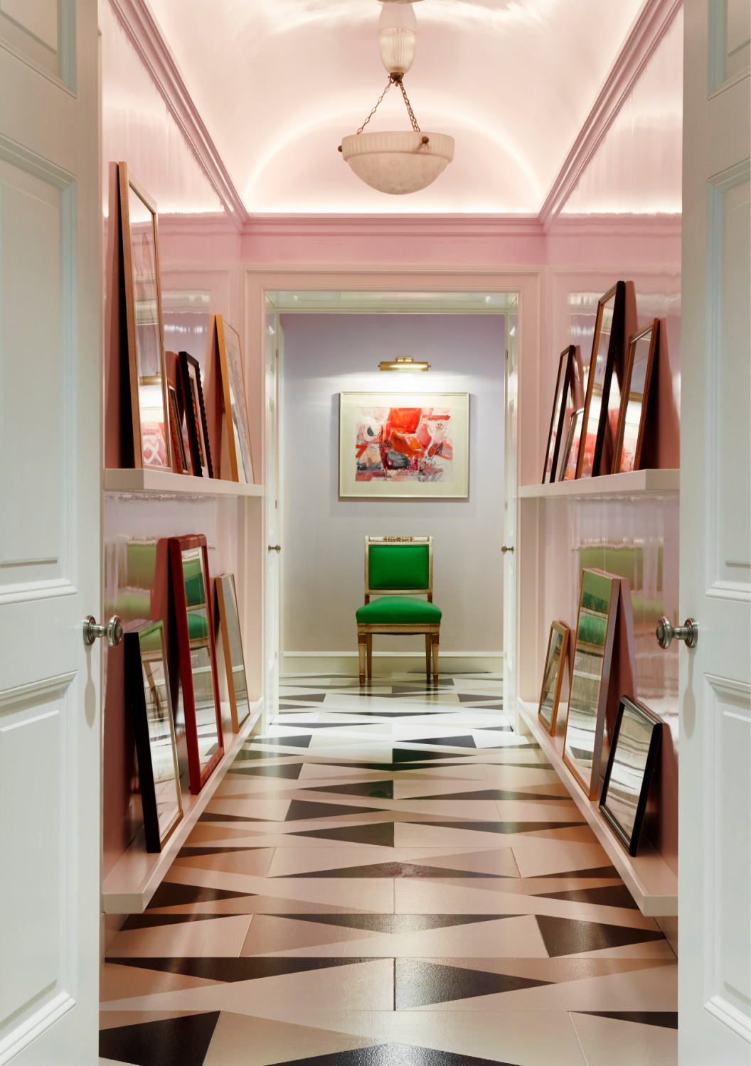 Summer Thornton designed hallway turned art gallery with pale lavender walls, geometric painted floors, and impossibly beautiful architecture. From WONDERLAND: Adventures in Decorating (Rizzoli, 2022). Photo by Thomas Loof. #summerthornton