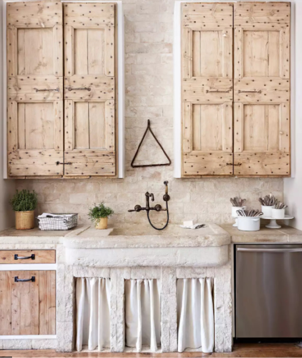 Soft pale colors, reclaimed wood, and stone farm sink in a luxuriously designed French country kitchen - BHG. #rustickitchens #oldworldkitchen #frenchkitchens