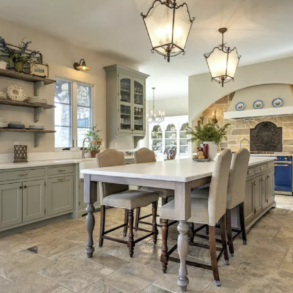 Open shelving, lantern pendants, and farm sink in Country French kitchen (French Design Formula).