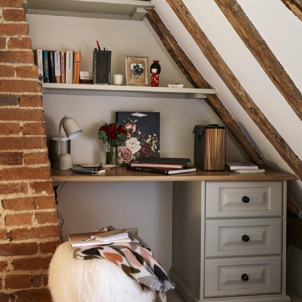 Built-in desk and shelves under stairs or eaves with exposed brick - @johnlewisofhungerford. #smallhomeoffice #builtindesk