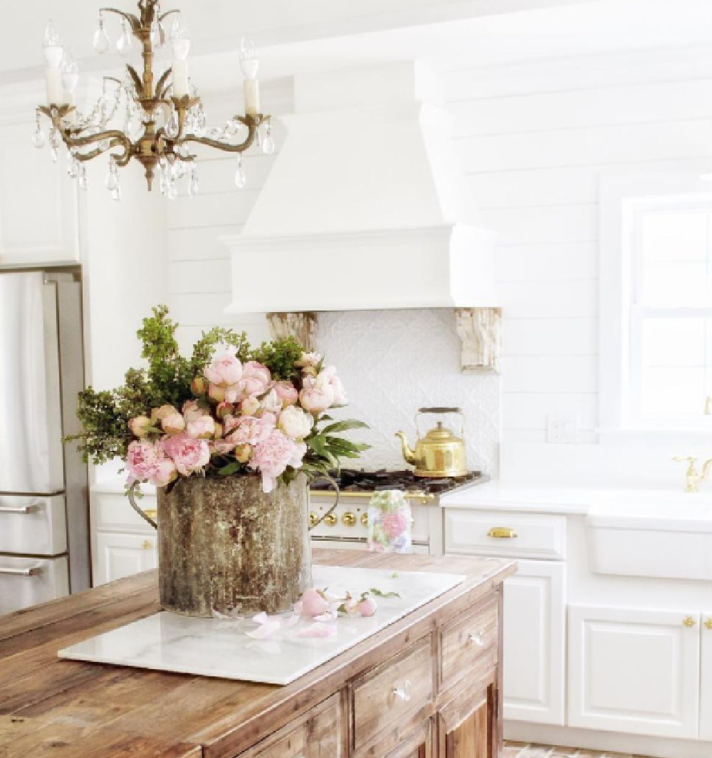 Romantic French country kitchen with luxury range and farm sink (Simply French Market). #frenchcountrykitchen #romantickitchens