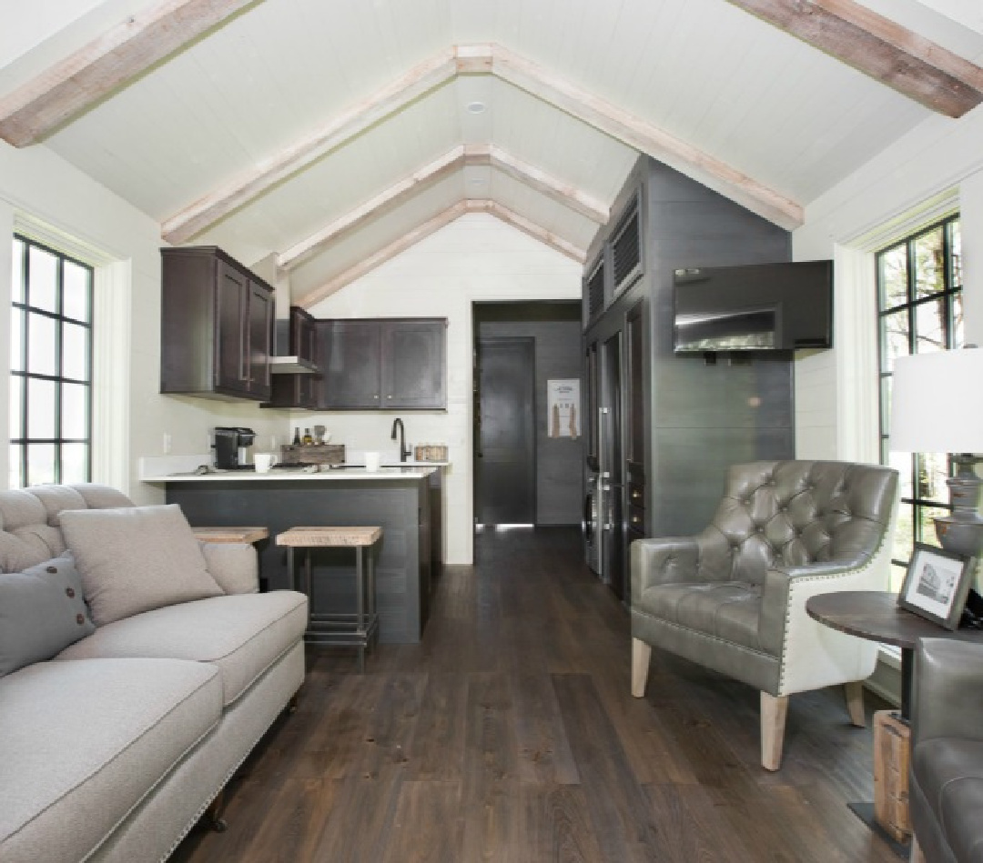 Living space interior in Jeffrey Dungan designed tiny house with finely crafted Low Country style -one of the cottages at The Retreat at Oakstone in Tennessee. #tinyhousedesign