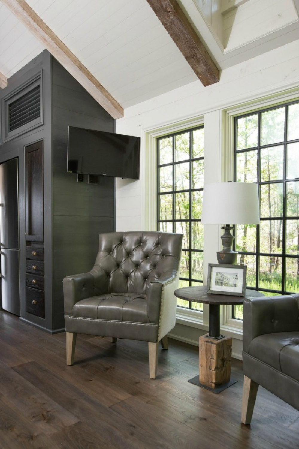 Living space interior in Jeffrey Dungan designed tiny house with finely crafted Low Country style -one of the cottages at The Retreat at Oakstone in Tennessee. #tinyhousedesign