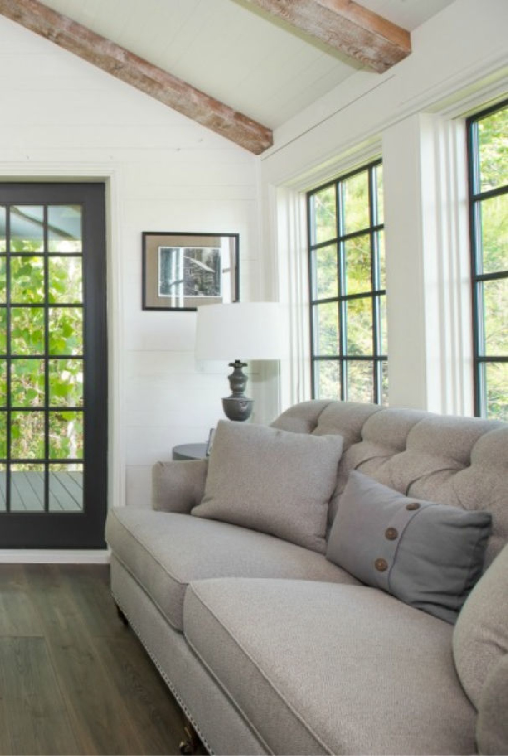 Living space interior in Jeffrey Dungan designed tiny house with finely crafted Low Country style -one of the cottages at The Retreat at Oakstone in Tennessee. #tinyhousedesign