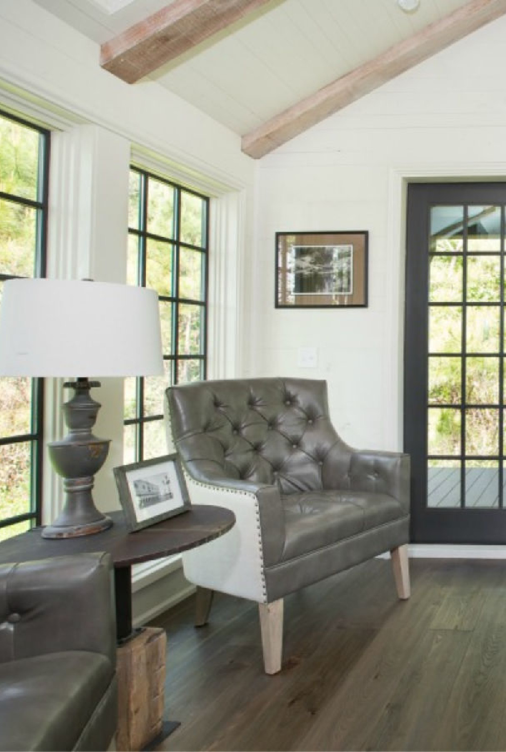 Living space interior in Jeffrey Dungan designed tiny house with finely crafted Low Country style -one of the cottages at The Retreat at Oakstone in Tennessee. #tinyhousedesign