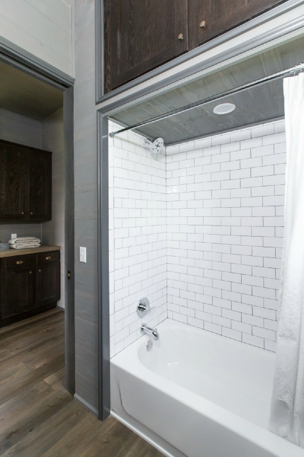 Bathroom in Jeffrey Dungan designed tiny house with finely crafted Low Country style -one of the cottages at The Retreat at Oakstone in Tennessee. #tinyhousedesign