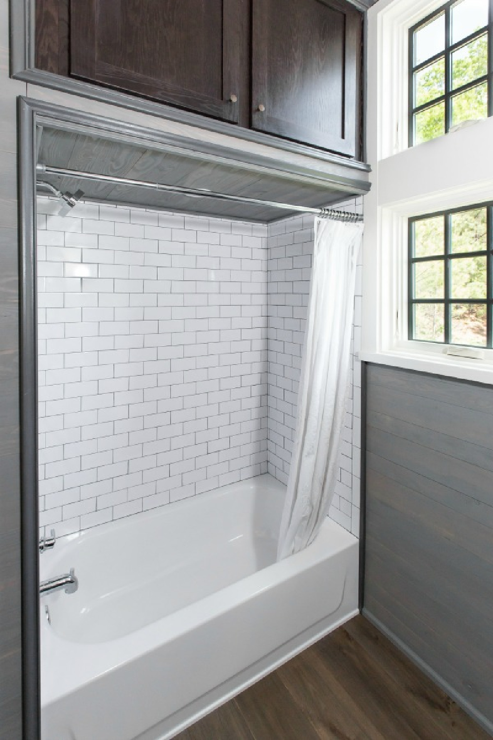 Bathroom in Jeffrey Dungan designed tiny house with finely crafted Low Country style -one of the cottages at The Retreat at Oakstone in Tennessee. #tinyhousedesign