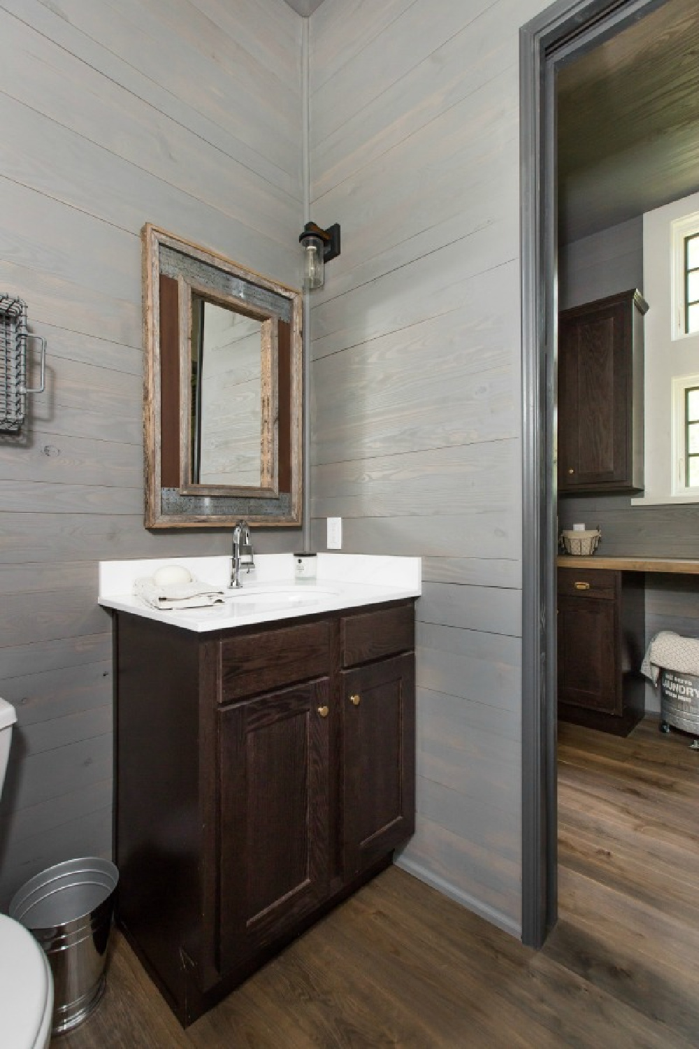 Bathroom with shiplap in Jeffrey Dungan designed tiny house with finely crafted Low Country style -one of the cottages at The Retreat at Oakstone in Tennessee. #tinyhousedesign