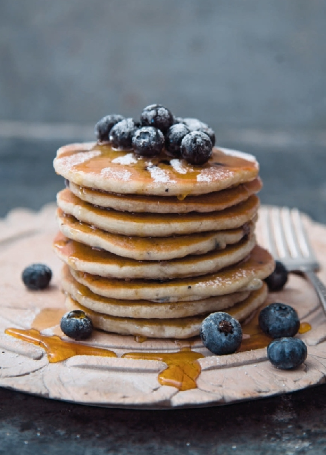 Gorgeous ricotta pancakes topped with blueberries in THE ART OF PANTRY COOKING by Ronda Carman (Rizzoli, 2022).