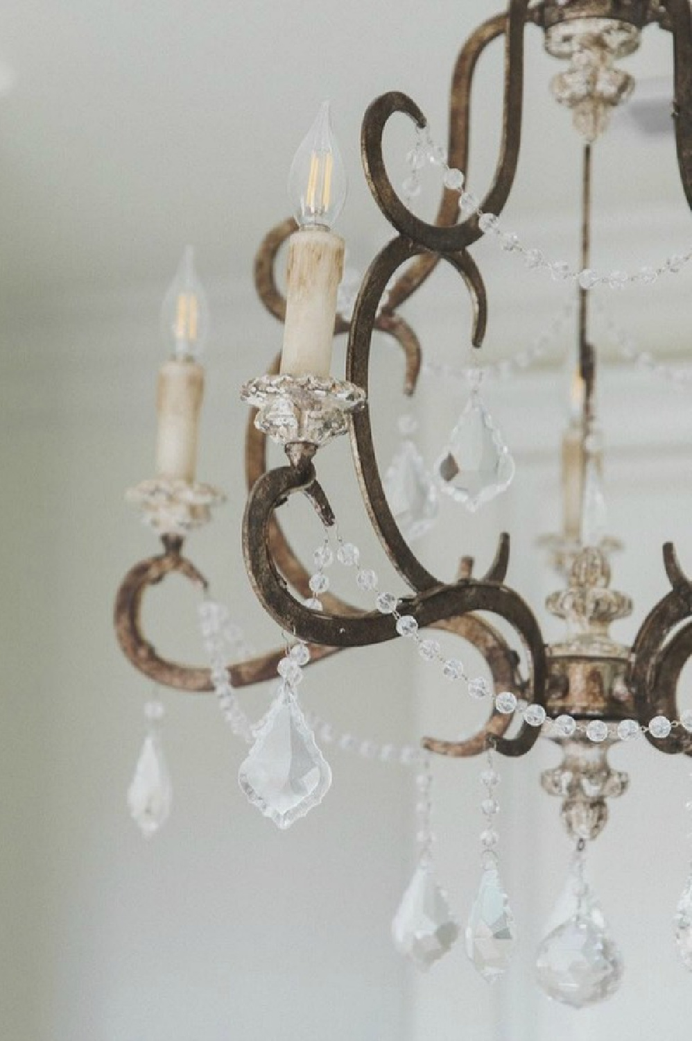 Terracotta Lighting's Ballerina chandelier with crystals in a bath by Brit Jones Design.
