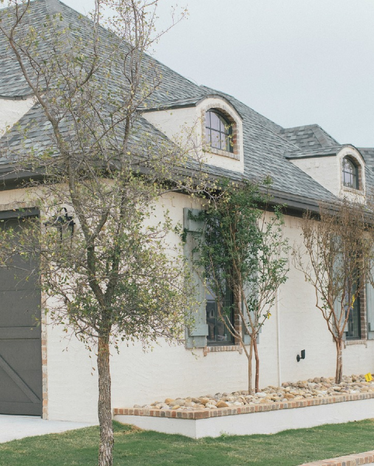 Stucco, brick, stone, and country French architecture for a new home in Texas - Brit Jones Design.