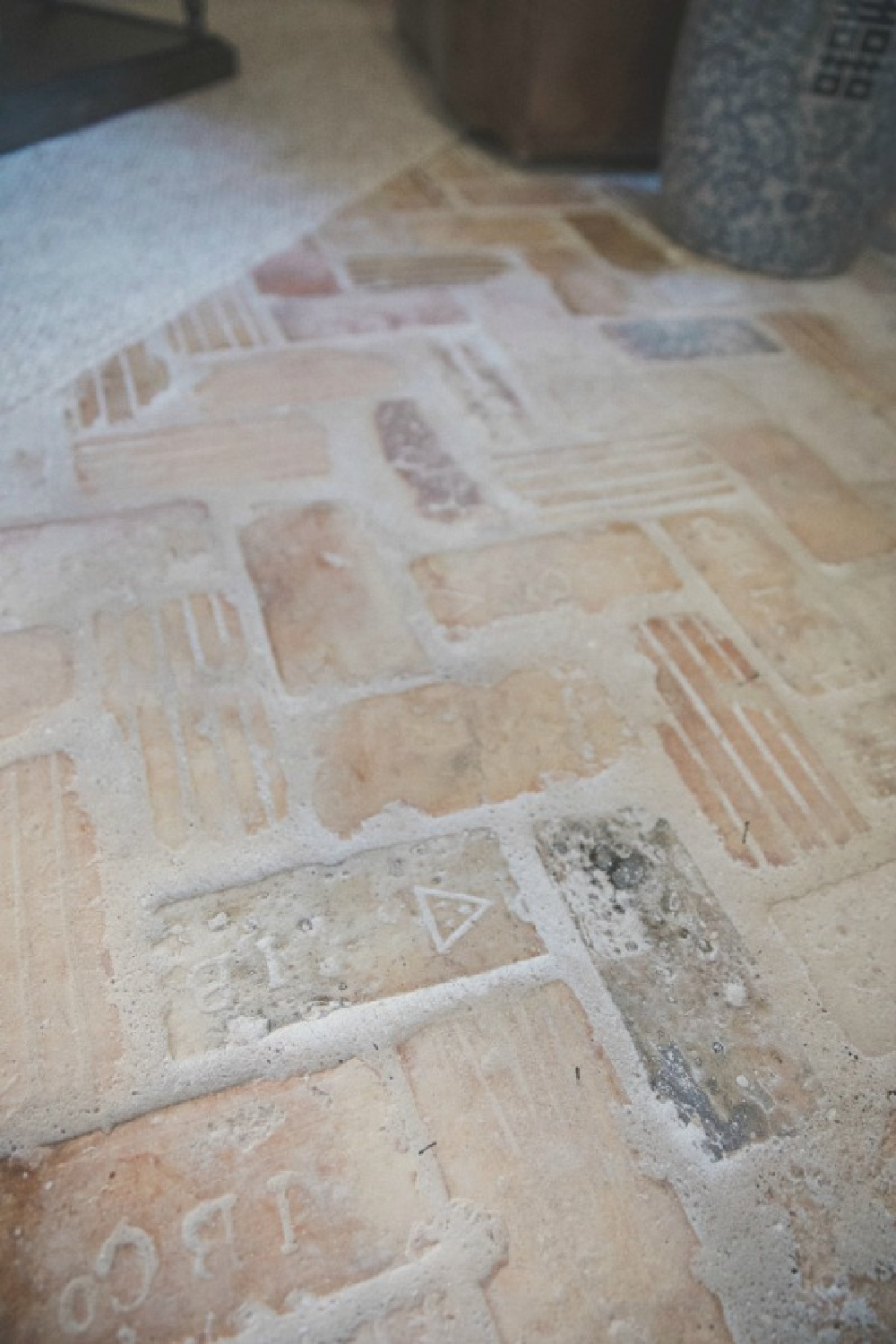 Detail of overgrouted Chicago brick floor in herringbone pattern - Brit Jones Design.