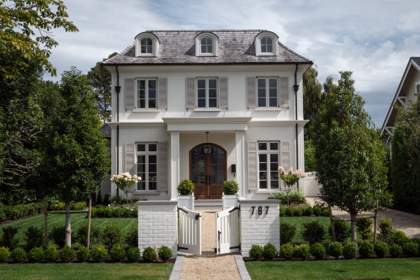Exterior facade of beautiful French country home with interior design by Jenny Martin Design. #frenchcountryhome #houseexteriors