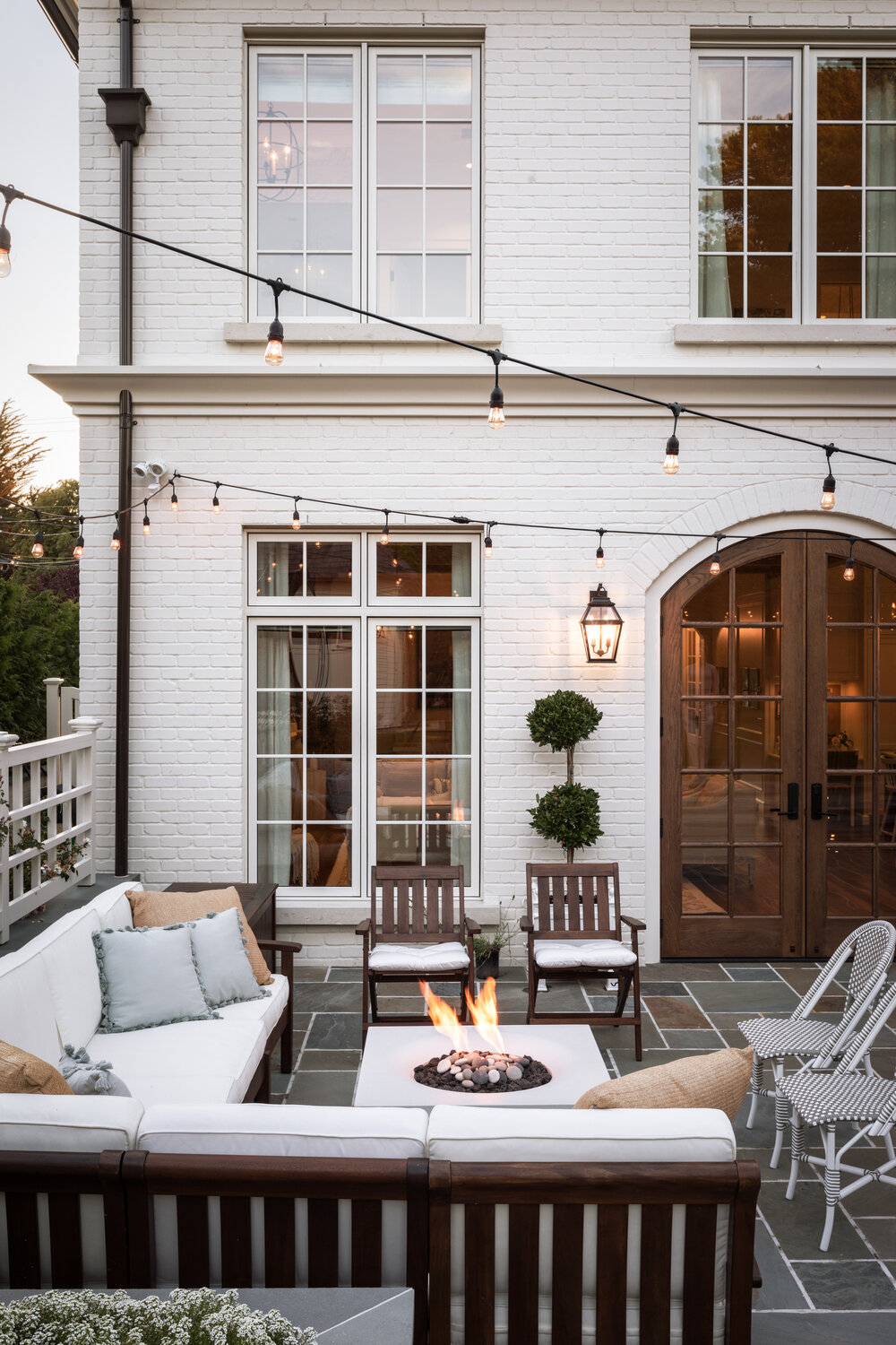 Patio at beautiful French country home with interior design by Jenny Martin Design. #frenchcountryhome #interiordesign