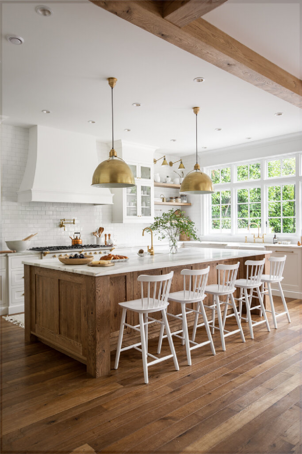 Kitchen with gold hardware in beautiful French country home with interior design by Jenny Martin Design. #frenchcountrykitchen #interiordesign