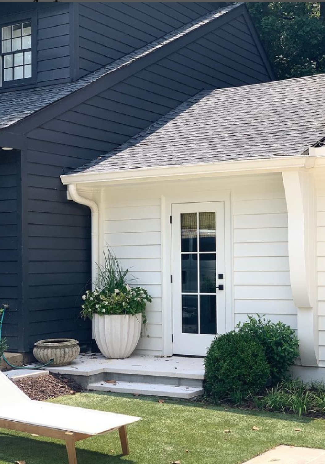 Black house exterior with contrasting white - Ladisic Fine Homes via Sherry Hart. #blackhouses #blackhouseexterior