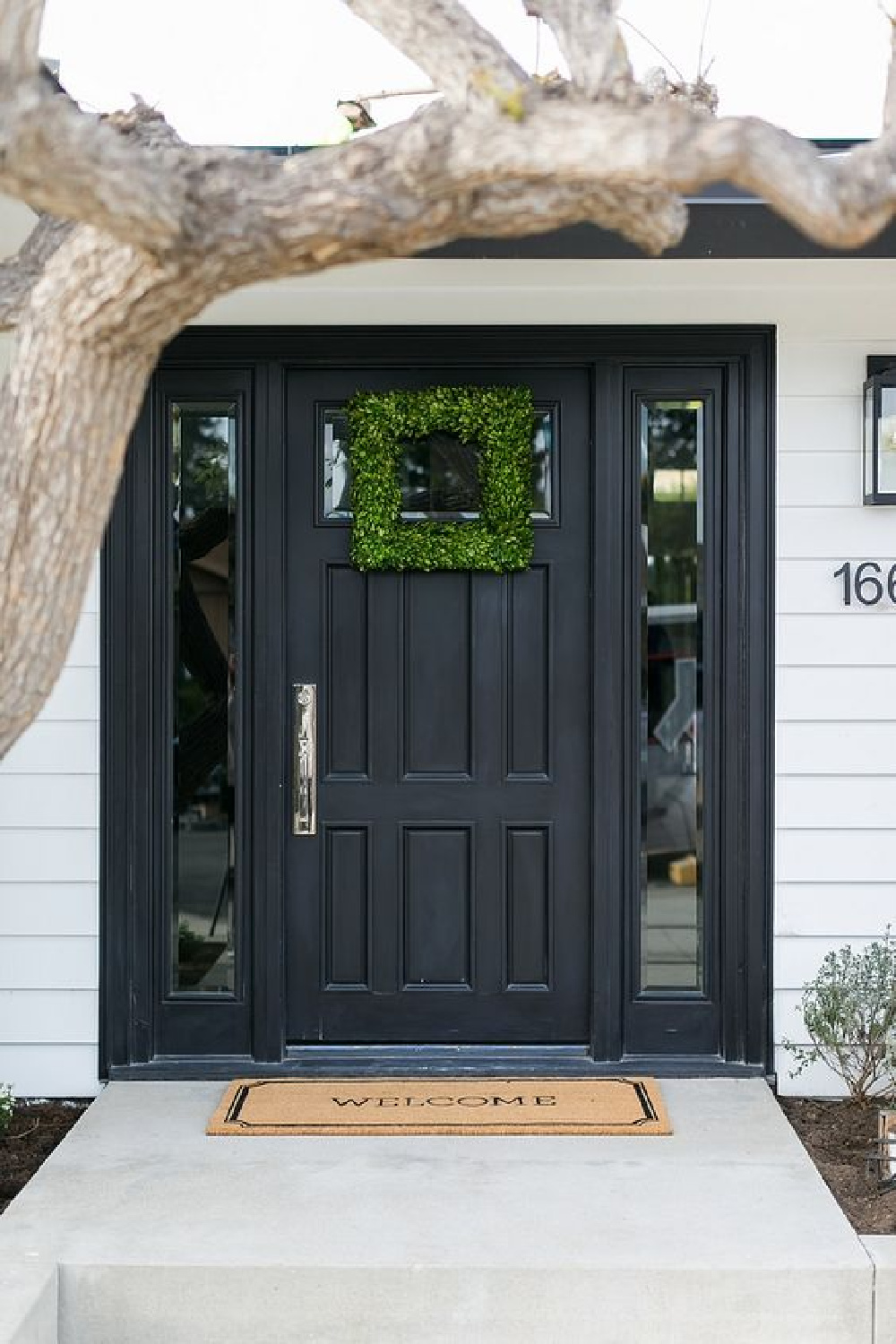 Black front door painted SW Tricorn Black - @agk_designstudio. #tricornblack #frontdoor