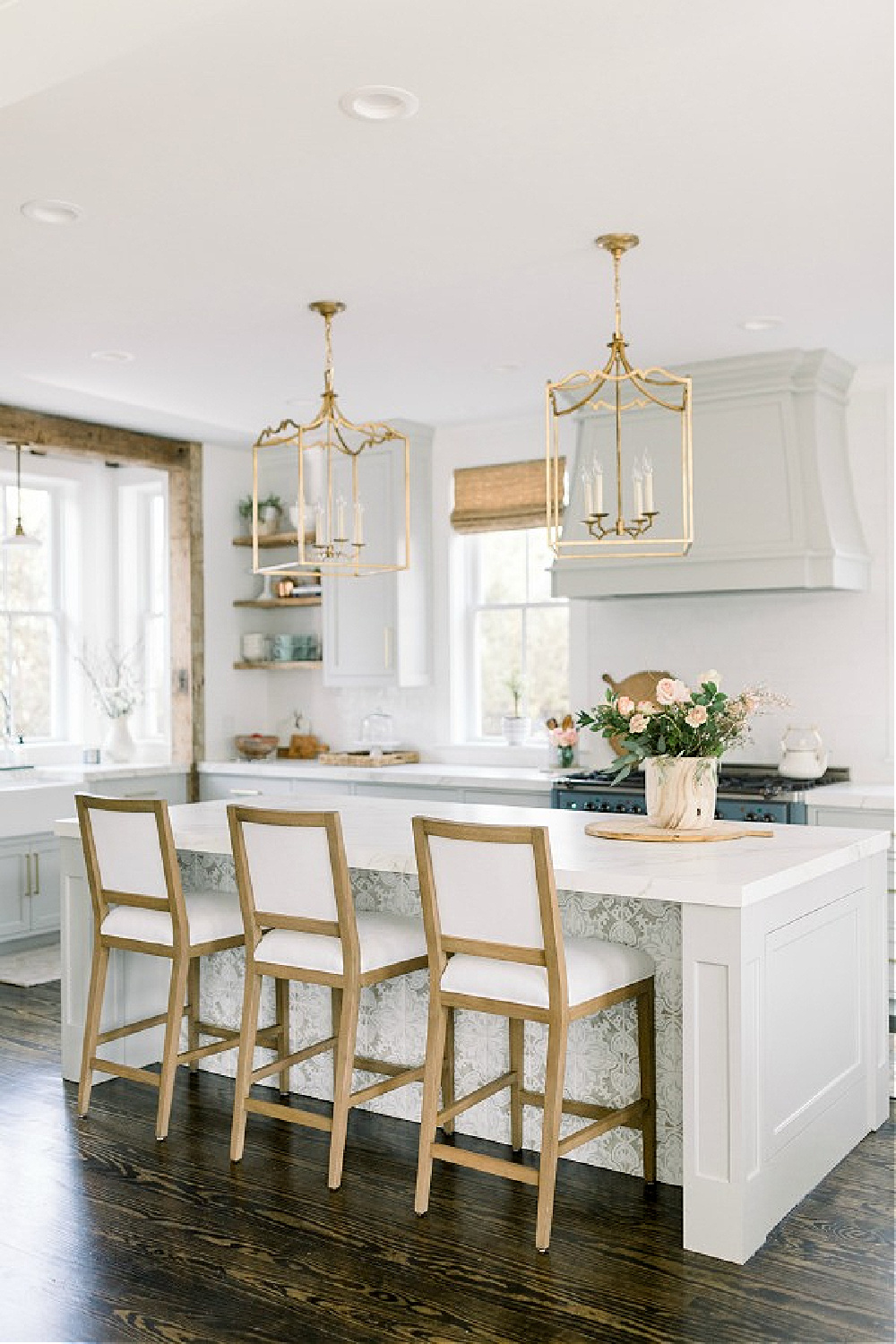 Elegant white farmhouse kitchen with Benjamin Moore Repose Grey cabinets, subway tile, gold accents, and reclaimed barn wood. Design: Finding Lovely. Come see Timeless Tranquil White & Grey Kitchen Tour. Wall color: Benjamin Moore Chantilly Lace.