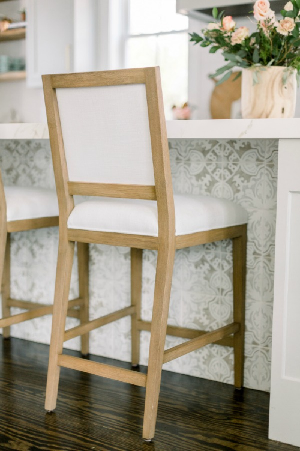 Elegant white farmhouse kitchen with Benjamin Moore Repose Grey cabinets, subway tile, gold accents, and reclaimed barn wood. Design: Finding Lovely. Wall color: Benjamin Moore Chantilly Lace.