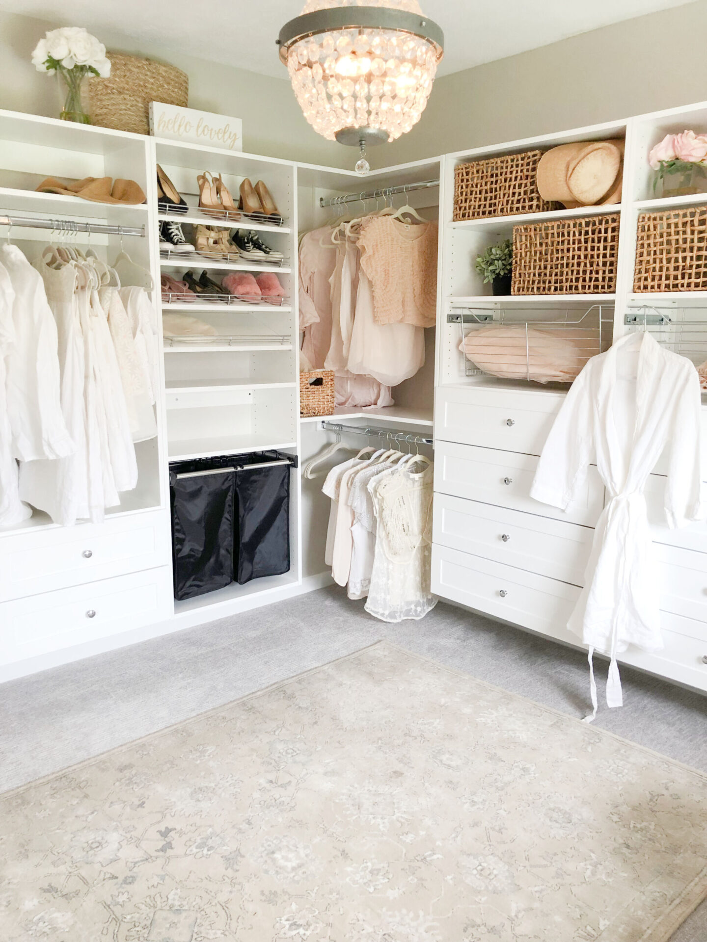 A pretty closet with plenty of shelves and storage in my "cloffice" space which I carved out of a spare bedroom - Hello Lovely Studio.