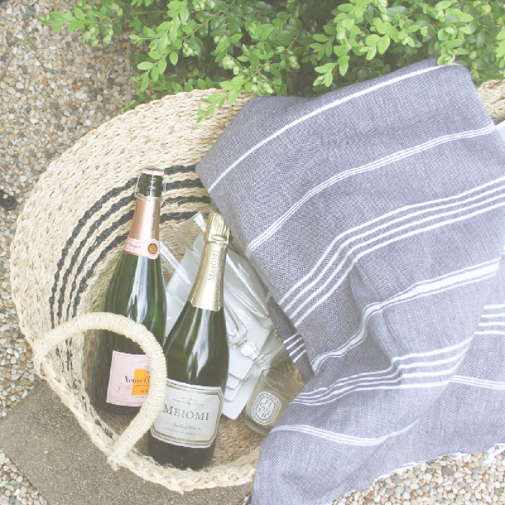Beachy basket with champagne and towel - Hello Lovely Studio. #coastalgrandmother #picnicbasket #summerliving