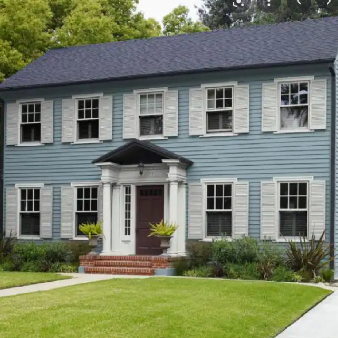 Blue Colonial style house exterior painted BEHR French Colony. #behrfrenchcolony #bluegraypaintcolors