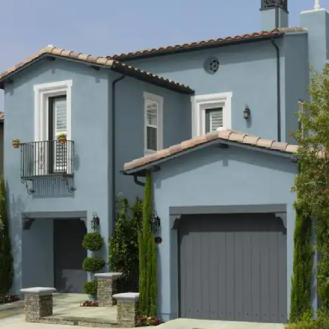 Blue Mediterranean style house exterior painted BEHR French Colony. #behrfrenchcolony #bluegraypaintcolors