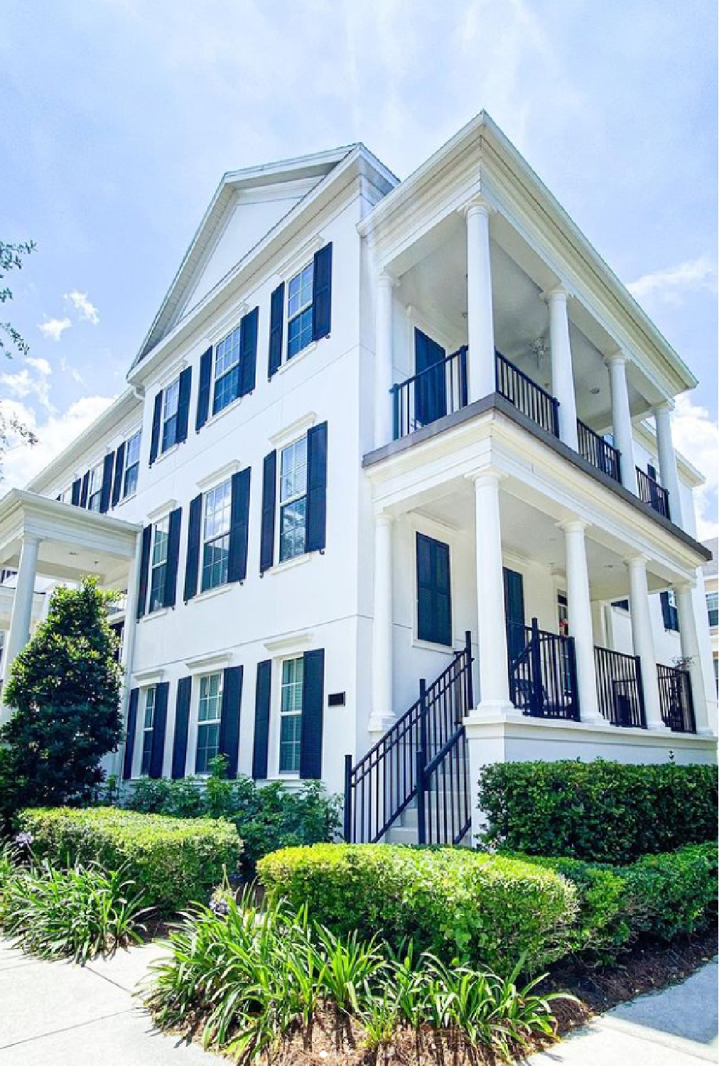 Chantilly Lace white painted house exterior with black shutters - @drs.inc. #whitehouses #chantillylace #houseexteriors