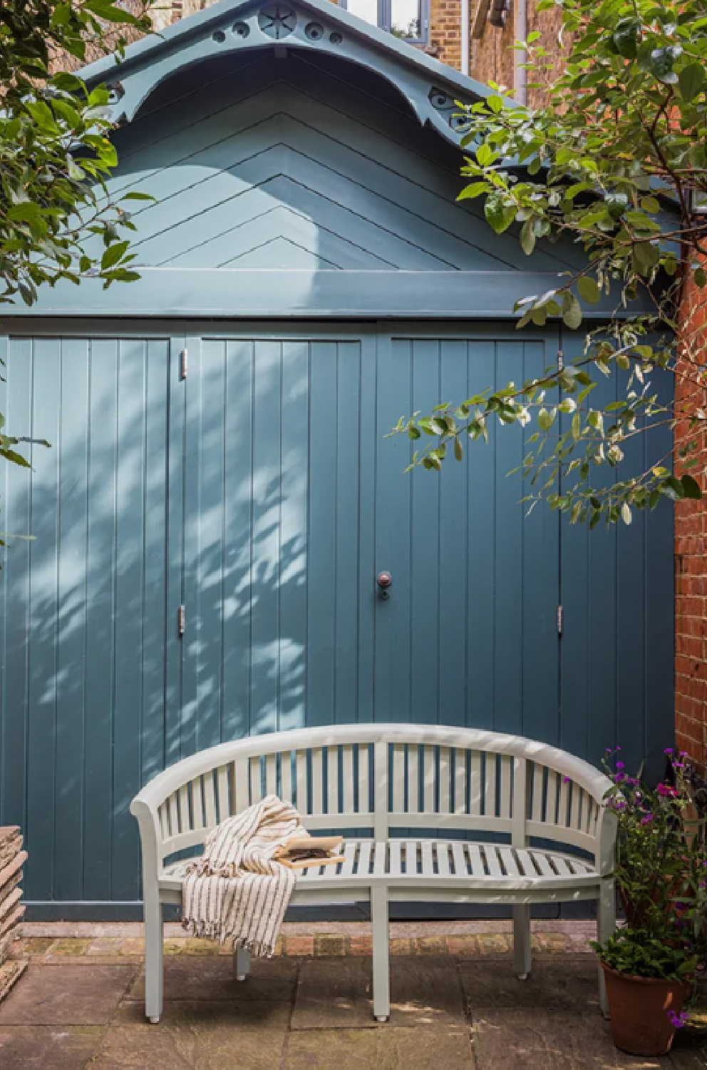 Farrow & Ball Blue Gray paint color on a garage exterior. #bluegray #paintcolors #farrowandballbluegray