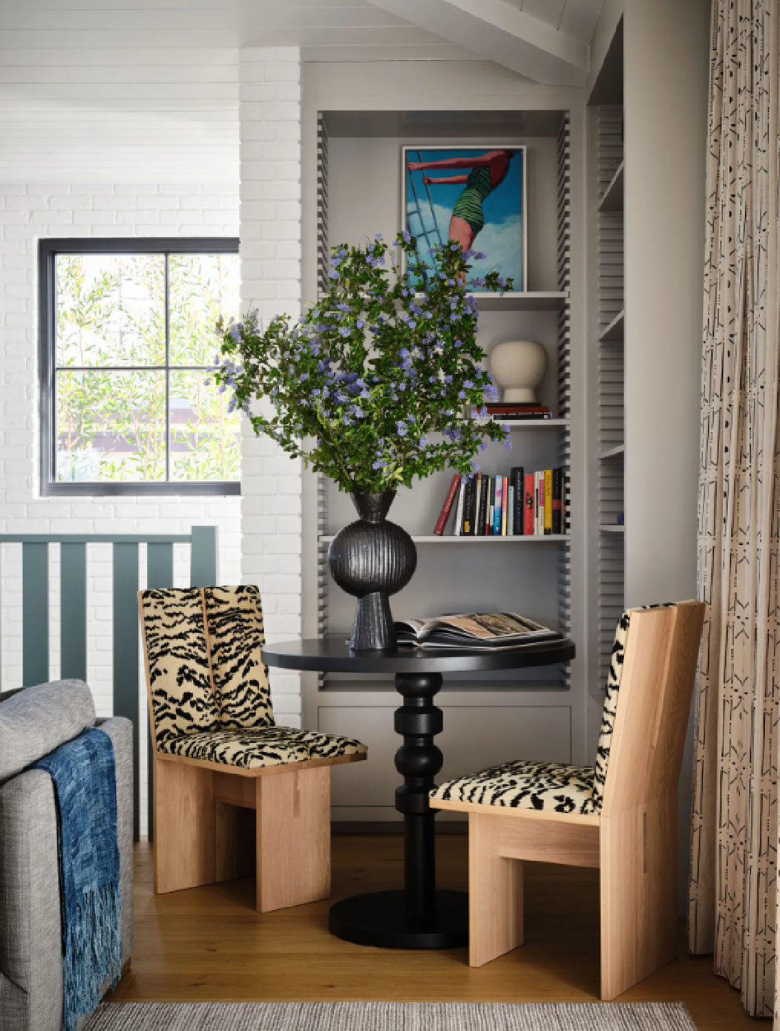 Pavilion Gray (Farrow & Ball) paint color on bookshelves in a cozy reading nook of a beach house living room (photo: Douglas Friedman; Interior Design: Kate Lester). #paviliongray #graypaintcolors