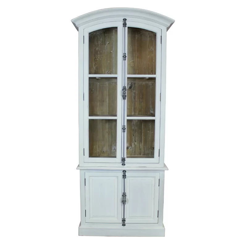 Etienne Vitrine is two separate pieces made of reclaimed solid pine with a white hand-painted exterior and bleached pine interior. Fully functioning French style casement hardware on upper and lower doors in antique silver finish. Upper doors have glass and lower doors have wood panels.Two non-adjustable shelves above and one below.
