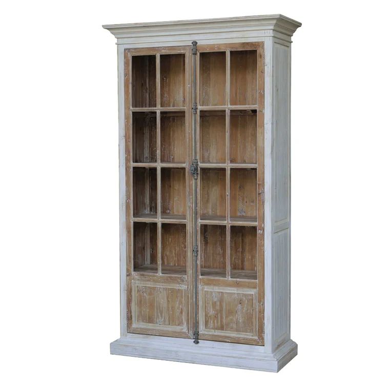 Vitrine made of solid reclaimed pine, inspired by vintage French doors.  The exterior has a painted finish; the doors and inside are bleached pine. Each piece is hand-finished and due to the bleaching process, no two are exactly alike.  Four non-adjustable shelves behind two glass front doors.  Fully functioning French casement style iron hardware.  Inside shelves measure 41"W x 13" D and are 14" apart. 