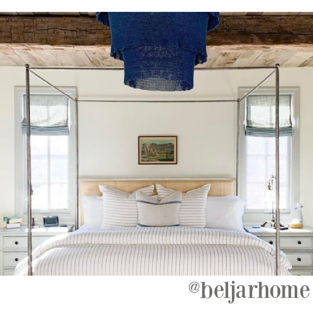 Luxurious yet laid back rustic elegant bedroom by Beljar Home with wood ceiling and canopy bed - soft blue linens heighten the tranquil factor. #timelessbedroom #rusticelegance #frenchcountrybedroom