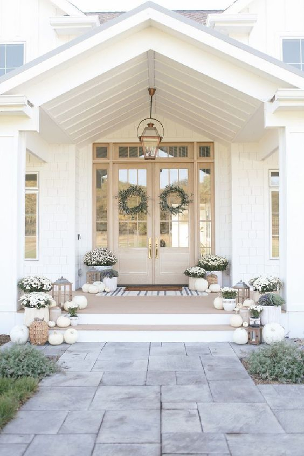 Simply White paint color on beautiful house exterior - via Prodsec. #simplywhite #whitehousecolors #paintcolors