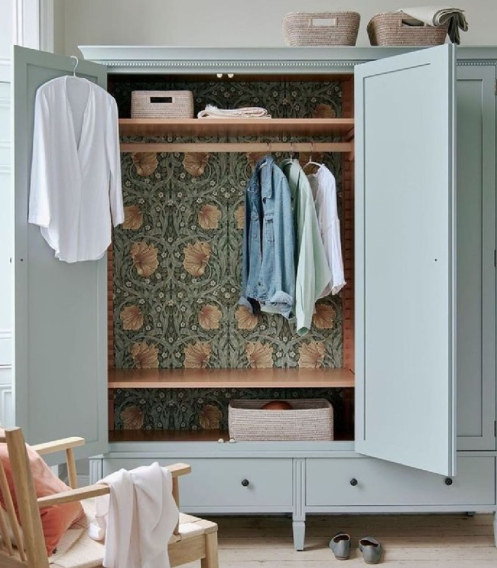 Aqua painted wardrobe lined with William Morris wallpaperr - @NeuptuneHomeOfficial. 