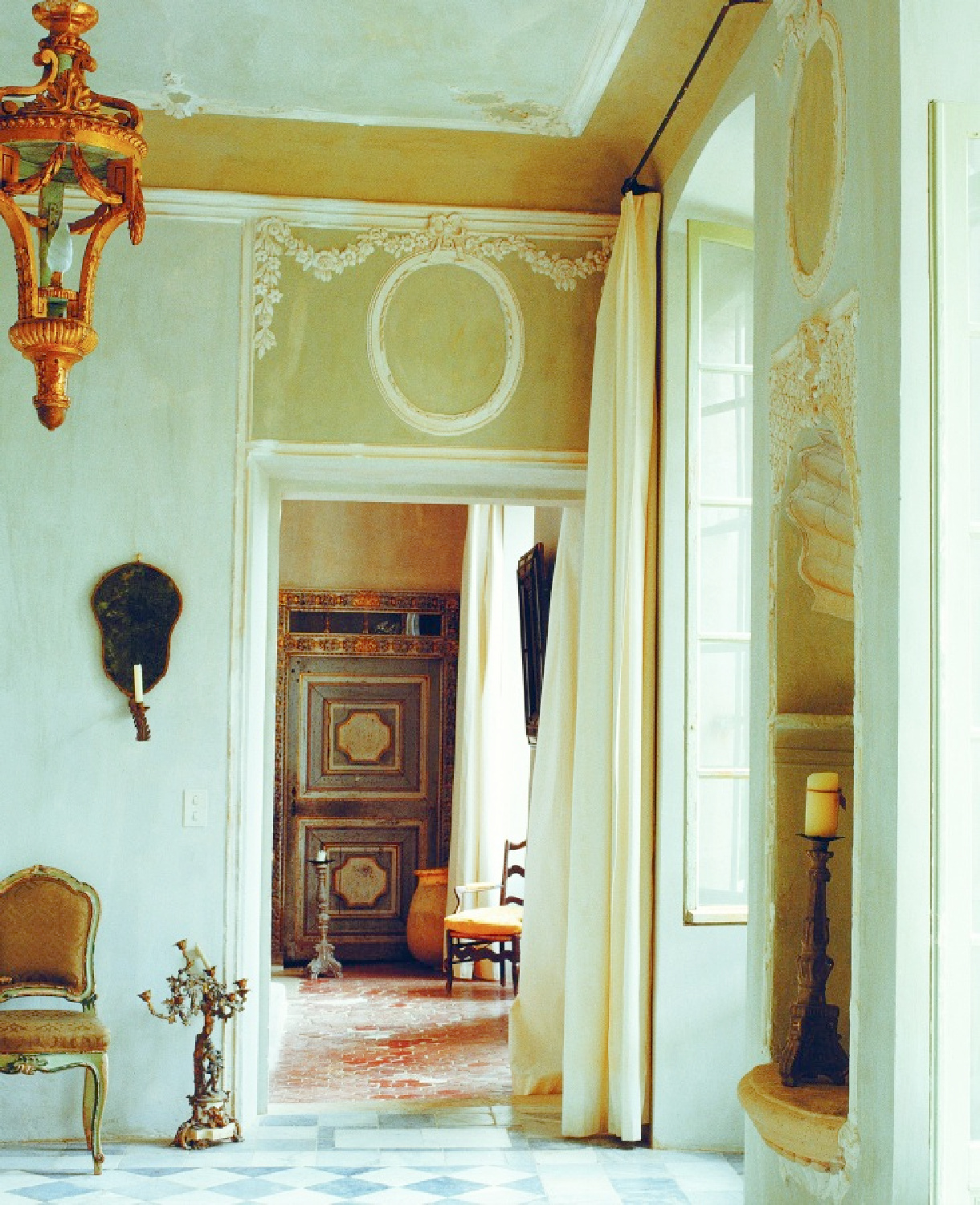 French country elegant Old World style interior with stone, terracotta, plaster, rustic decor, and antiques - from La Vie Est Belle by Henrietta Heald. #frenchcountryinteriors