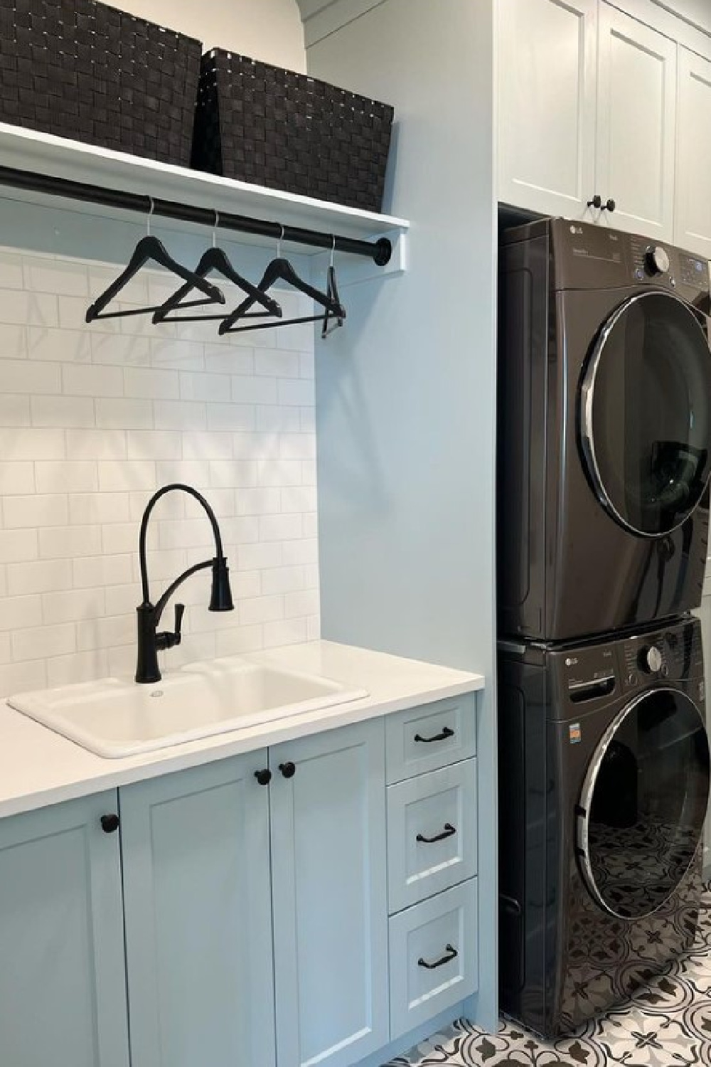 Smoke (Benjamin Moore) blue paint color on laundry room cabinets - @bayle_home. #smoke #bluepaintcolors