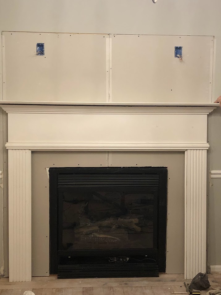 Dining room fireplace during Georgian renovation - reclaimed mantel surround