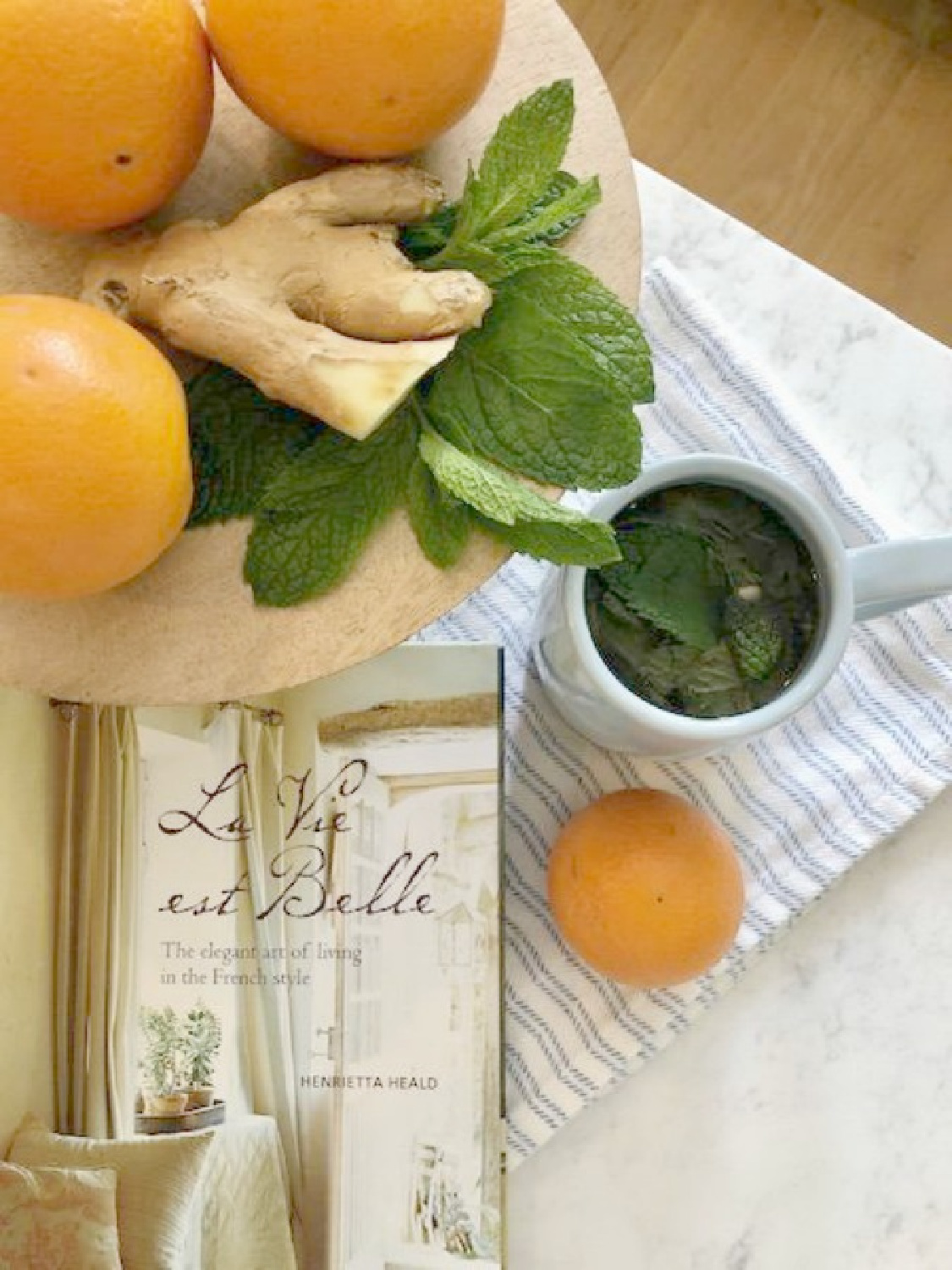 Ingredients for mint ginger tea assembled on a tray in Hello Lovely's French inspired kitchen.