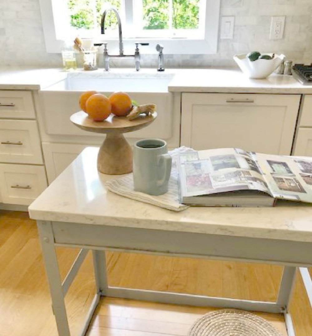 Hello Lovely Studio's white Shaker kitchen with ingredients for mint ginger tea on the counter. #frenchkitchen #frenchfarmhousekitchen