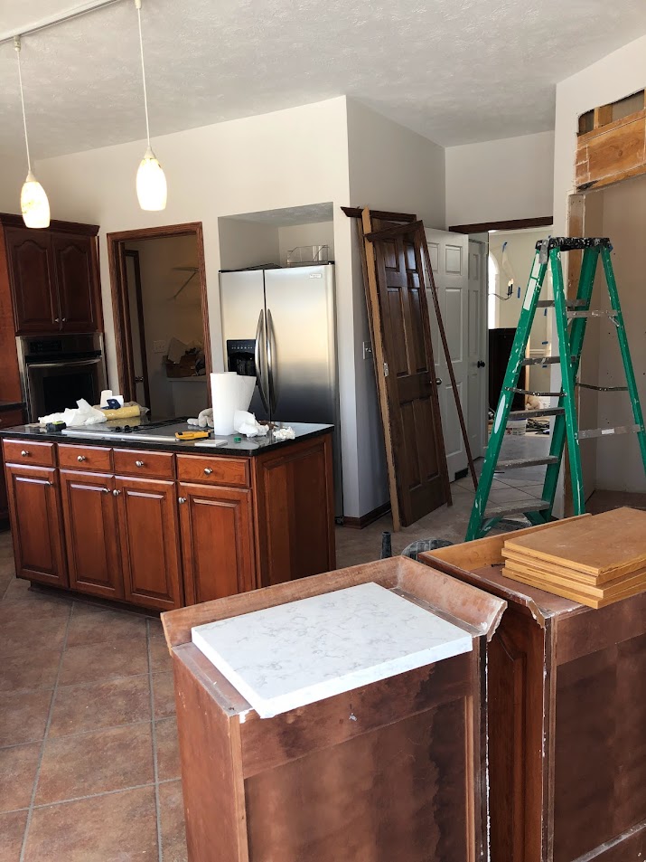 Kitchen during construction and Georgian renovation
