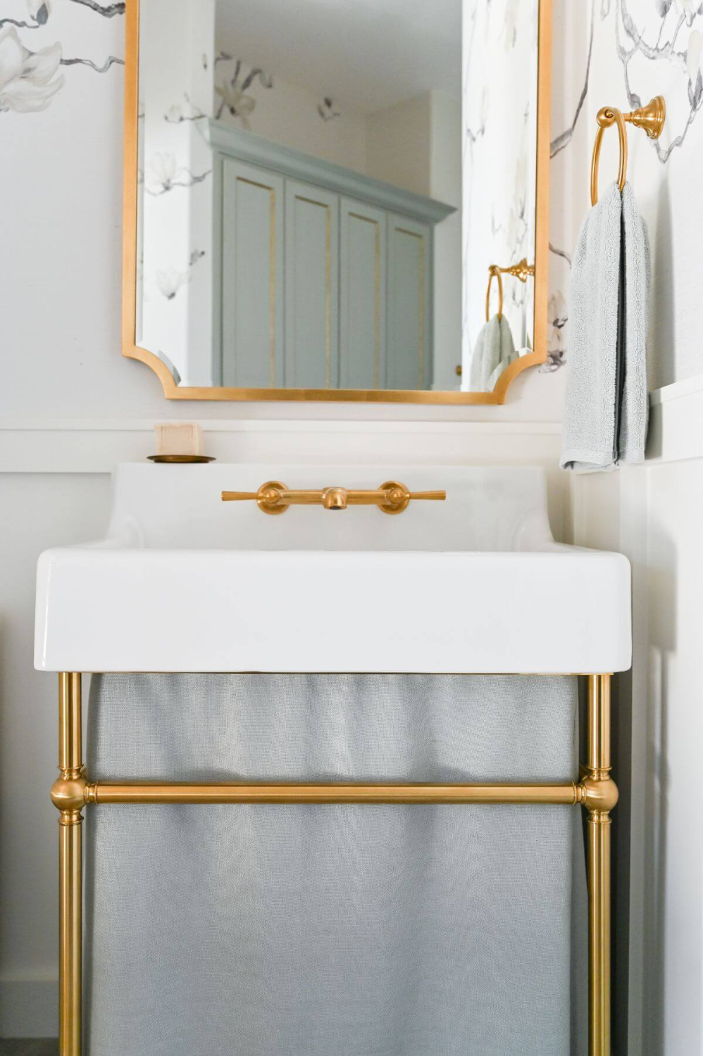 Beautiful modern French bathroom with grey branch wallpaper and console sink - Morningstar Builders. #frenchbathroom #modernfrenchbath #wallpaperedbathroom