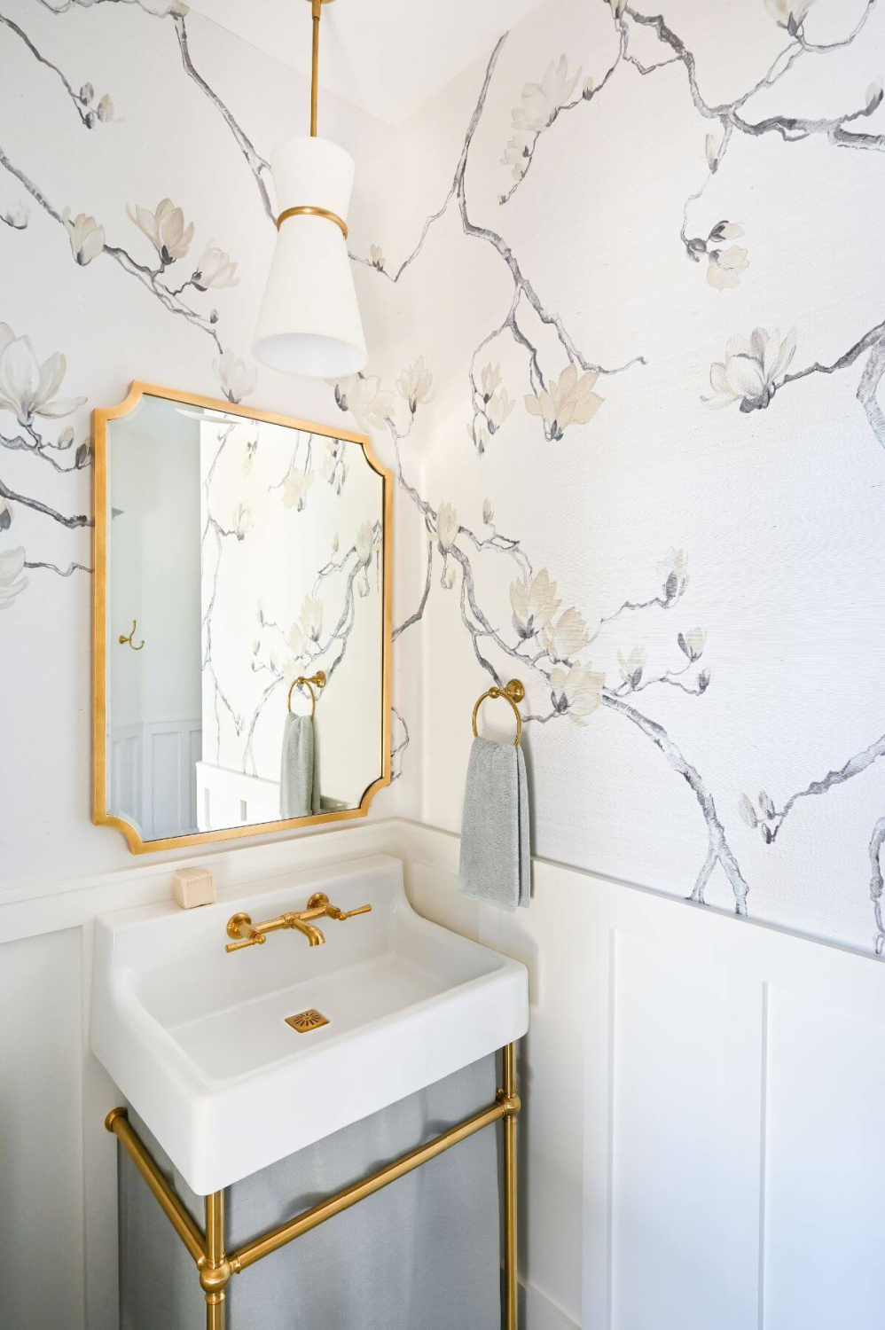 Beautiful modern French bathroom with grey branch wallpaper and console sink - Morningstar Builders. #frenchbathroom #modernfrenchbath #wallpaperedbathroom