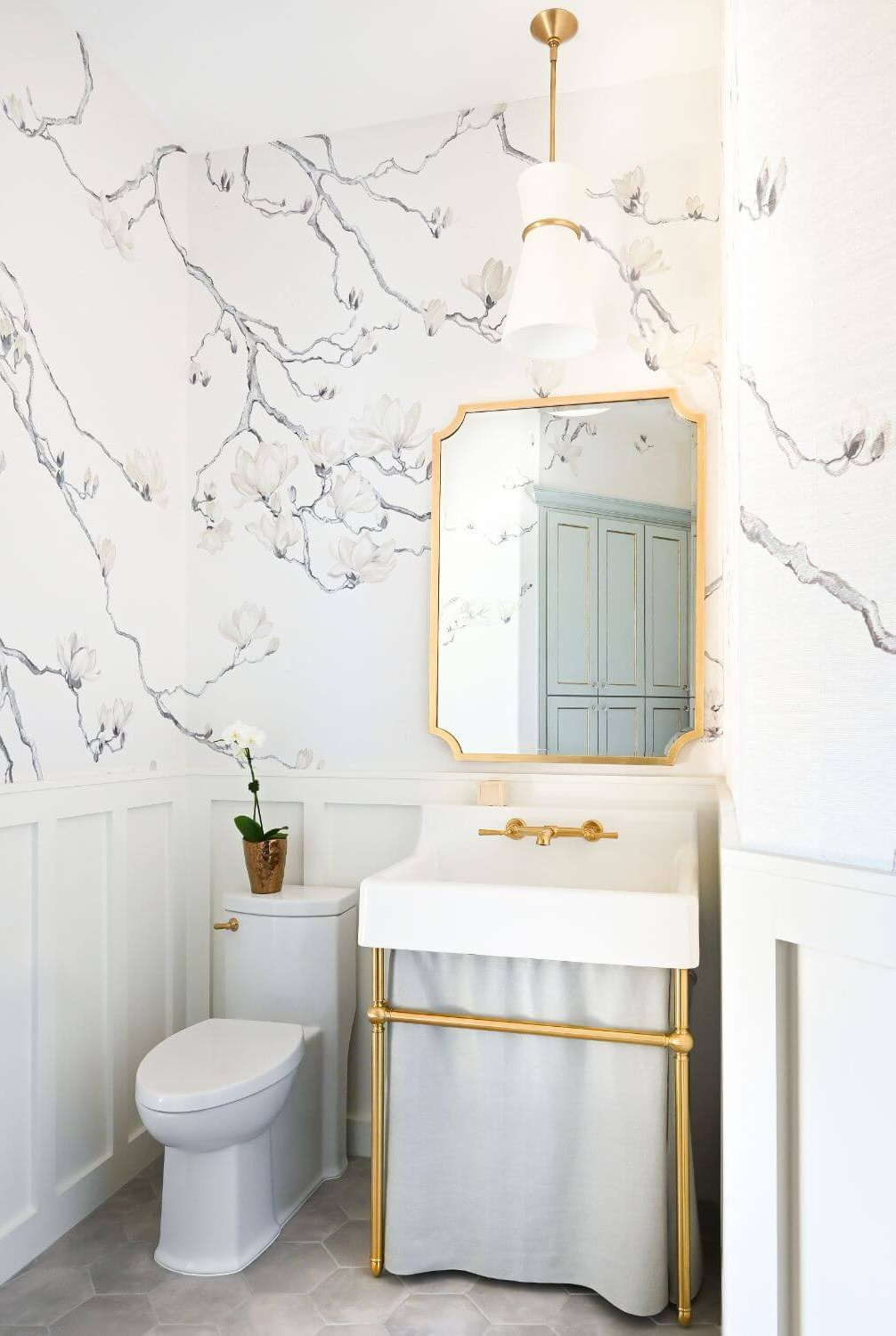 Beautiful modern French bathroom with grey branch wallpaper and console sink - Morningstar Builders. #frenchbathroom #modernfrenchbath #wallpaperedbathroom