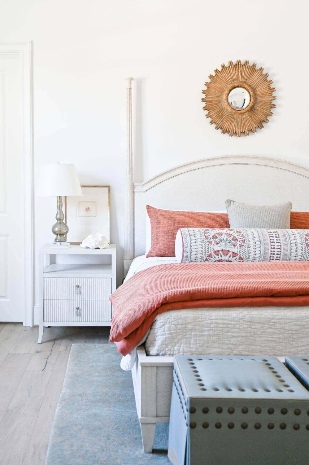 Beautiful modern French country bedroom with orange accents and pale furniture - Morningstar Builders. #frenchbedroom #modernfrench #bedroomdecor